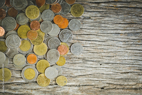 Close up  coin on wood background selective and soft focus hipster tone