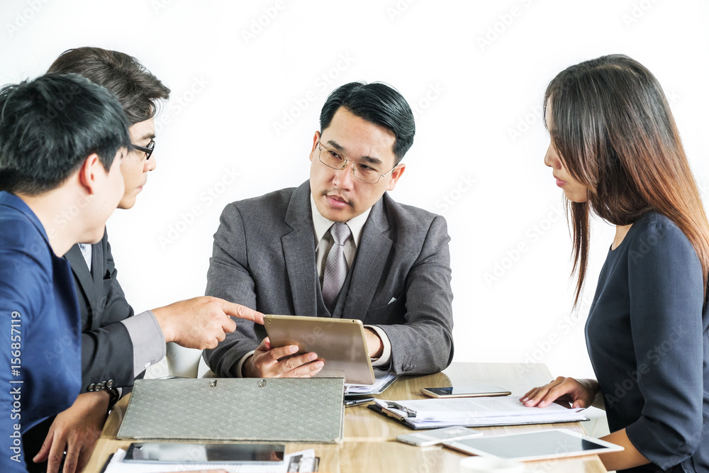 Portrait Of Multiracial Businesspeople Brainstorming In Meeting