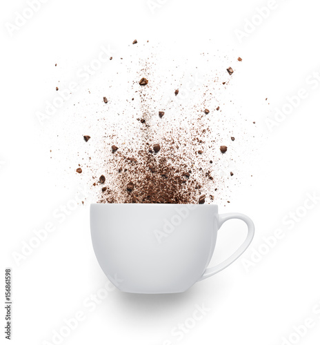 Coffee powder spilled out from cup isolated on white background