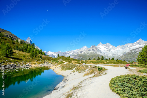 Gruensee  Green lake  with view to Matterhorn mountain - trekking in the mountains near Zermatt in Switzerland