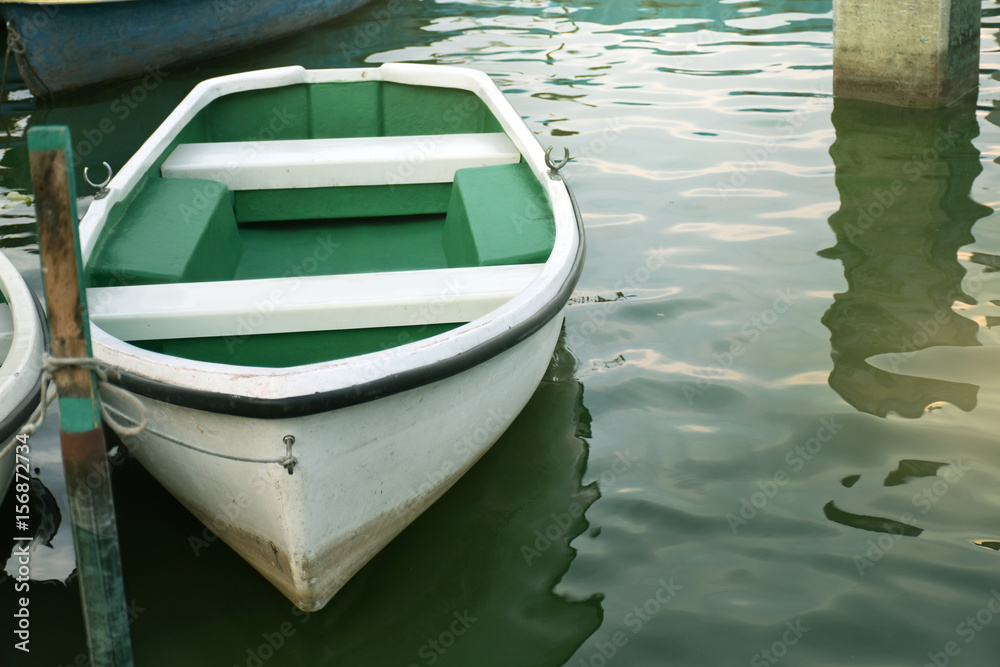 White rowboat moored near shore. - Concept boat, quiet, wait, life, hope