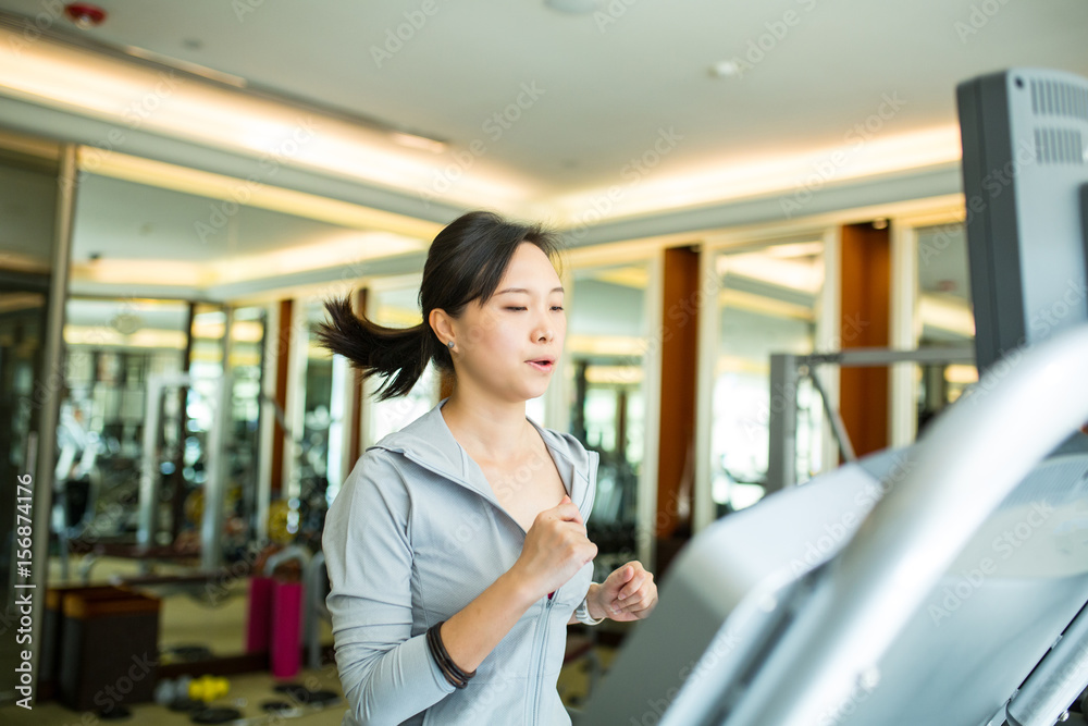 Asian woman running with machine walking Asian woman running with machine walking