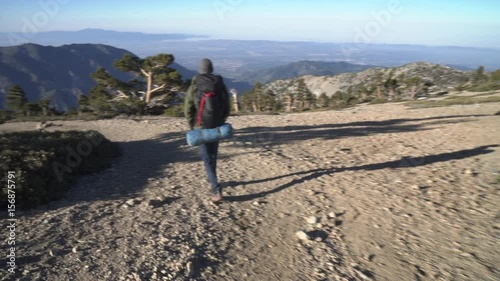 Hiker on a trail alone in the wilderness