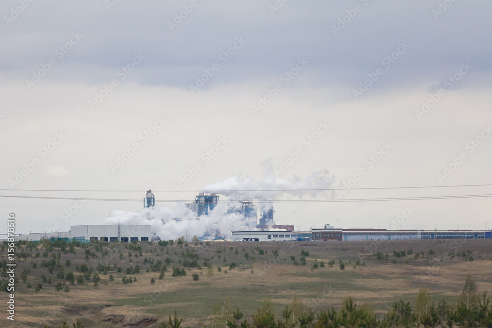 Views of the industrial plant in the middle of a field Views of the industrial plant in the middle of a field