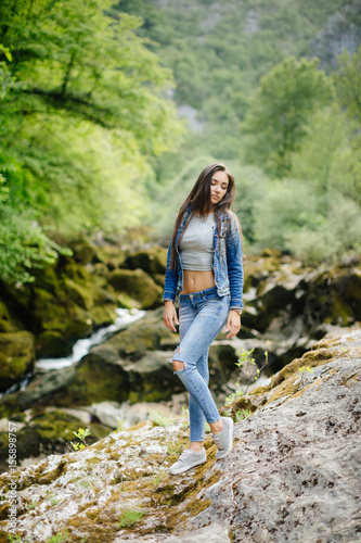 long hair woman posing in mountains