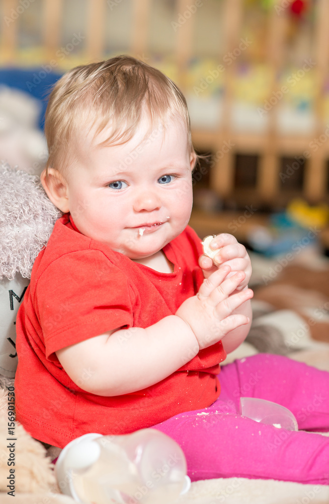 A baby child with blue eyes looks at the camera A baby child with blue eyes looks at the camera