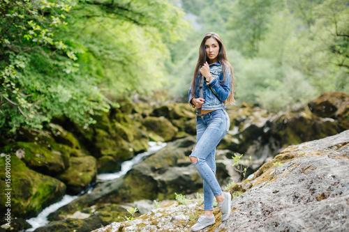 long hair woman posing in mountains