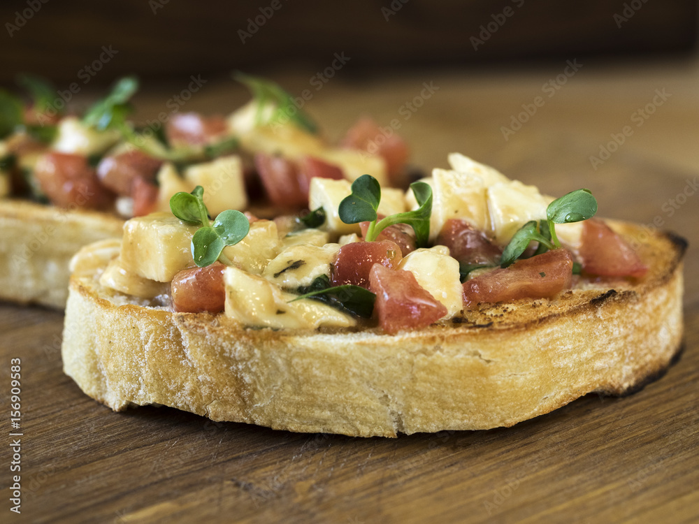 Bruschetta with mozzarella and tomatoes Bruschetta with mozzarella and tomatoes