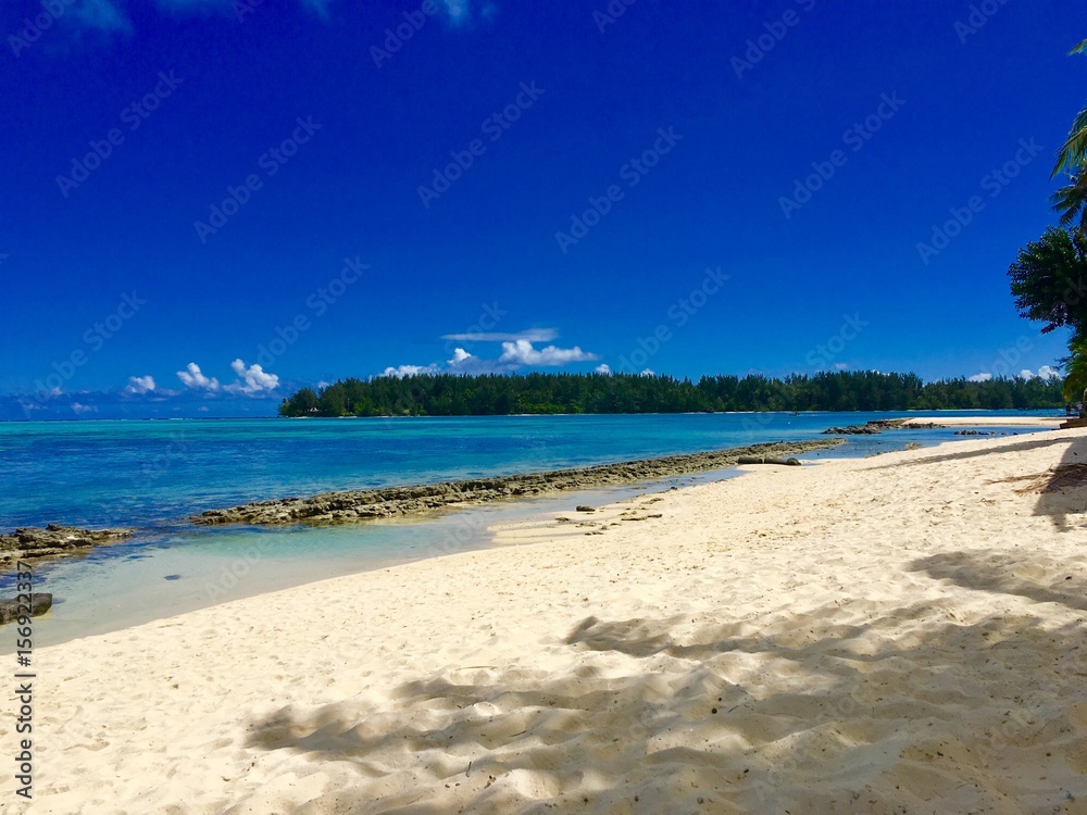 Beautiful white sanded beach and turquoise lagoon of Moorea, Tahiti, French Polynesia