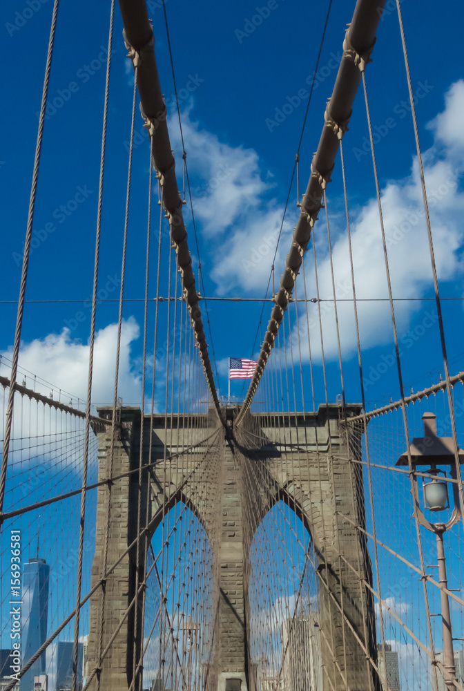 Fototapeta premium Brooklyn Bridge with American flag