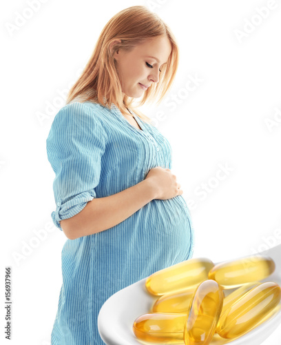 Pregnant woman on light bac...