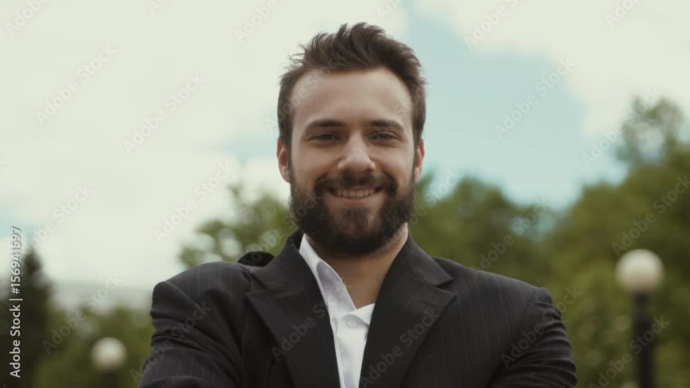 portrait of male businessman smiling looking to camera portrait of male businessman smiling looking to camera