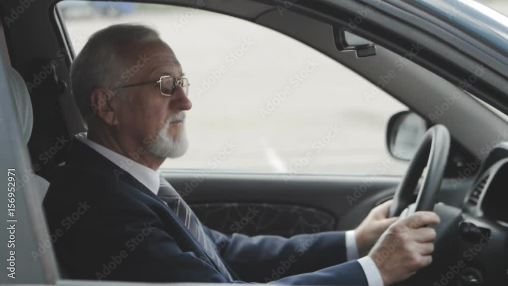 Senior man into the car. Businessman sitting in auto. Senior man into the car. Businessman sitting in auto.