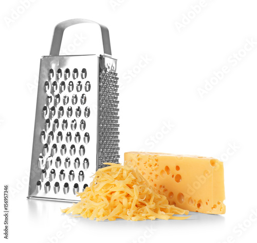 Grater and cheese on white background