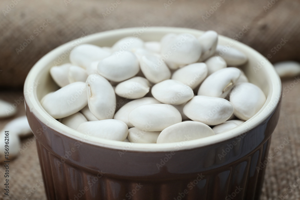 Ceramic bowl with butter beans, closeup Ceramic bowl with butter beans, closeup