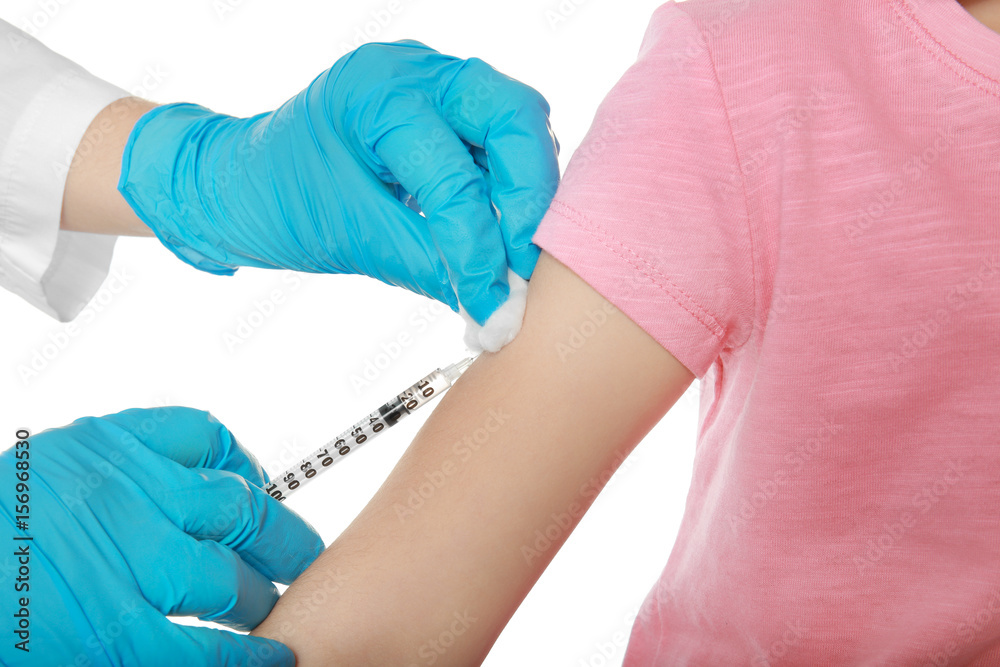 Vaccination concept. Female doctor vaccinating cute little girl on white background, closeup Vaccination concept. Female doctor vaccinating cute little girl on white background, closeup