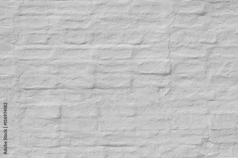 Whitewash  painted old brick wall  with plaster texture. Background  for text or image. 