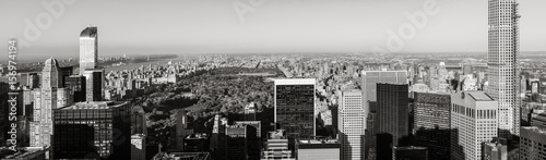 Black & White aerial panoramic view of Central Park with Midtown skyscrapers, Upper West and Upper East Side buildings. Manhattan, New York City