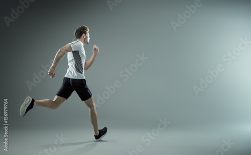 Running, young male athlete - isolated
