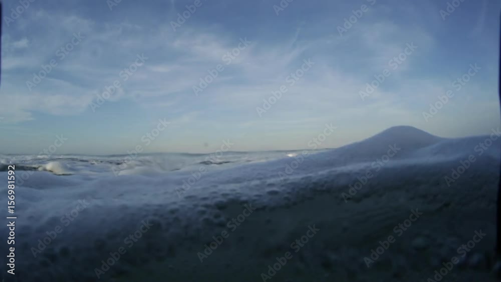 Camera shoots barreling wave and moves underwater Camera shoots barreling wave and moves underwater