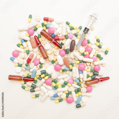 Pile of Pills, Tables and Capsules Isolated on White Background