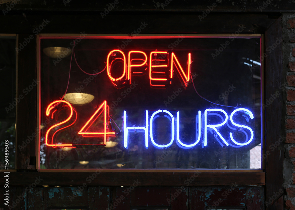 Fototapeta premium Open 24 Hours neon sign on a restaurant.