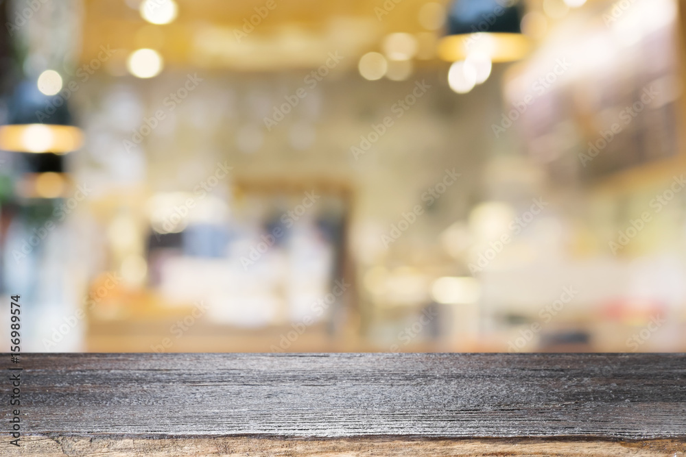 Empty wooden table for present product on coffee shop or soft drink bar blur background with bokeh image Empty wooden table for present product on coffee shop or soft drink bar blur background with bokeh image