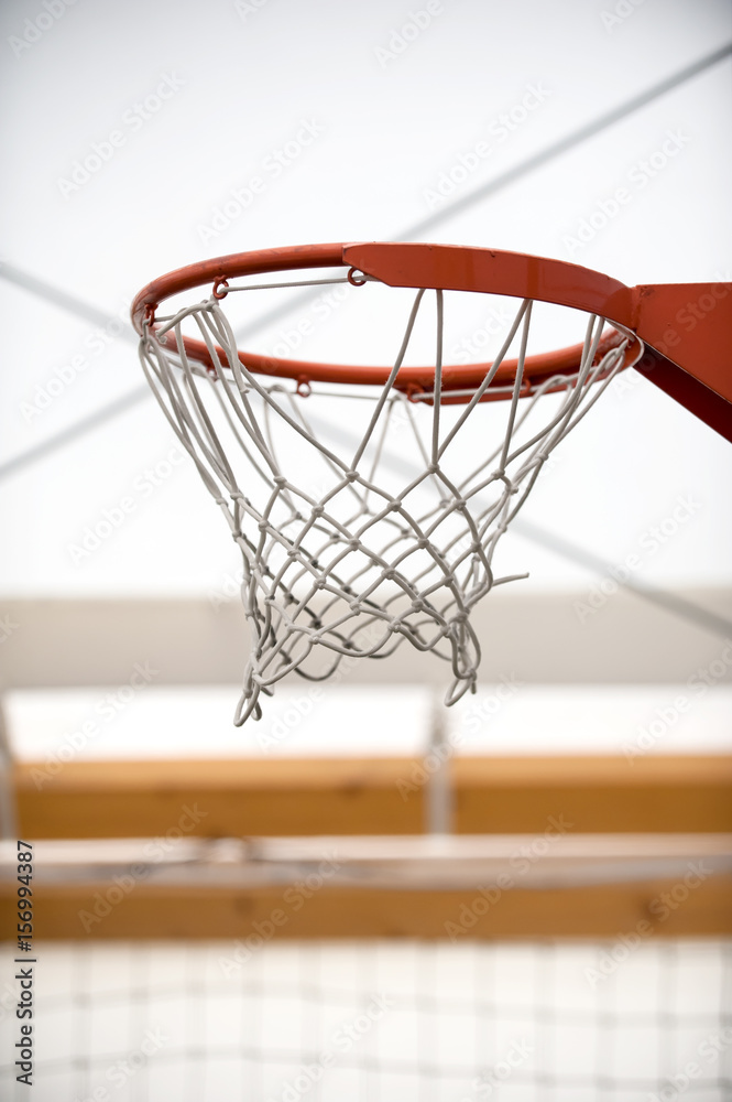 Basketball hoop in sport school gym hall