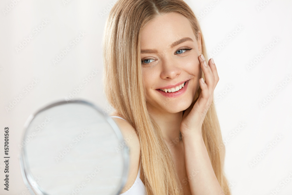 Facial Beauty. Sexy Woman With Healthy Skin Looking In Mirror Facial Beauty. Sexy Woman With Healthy Skin Looking In Mirror