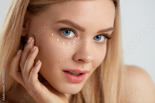 Wallpaper Mural Facial Care. Woman With Drops Of Cosmetic Cream Under Eye Torontodigital.ca