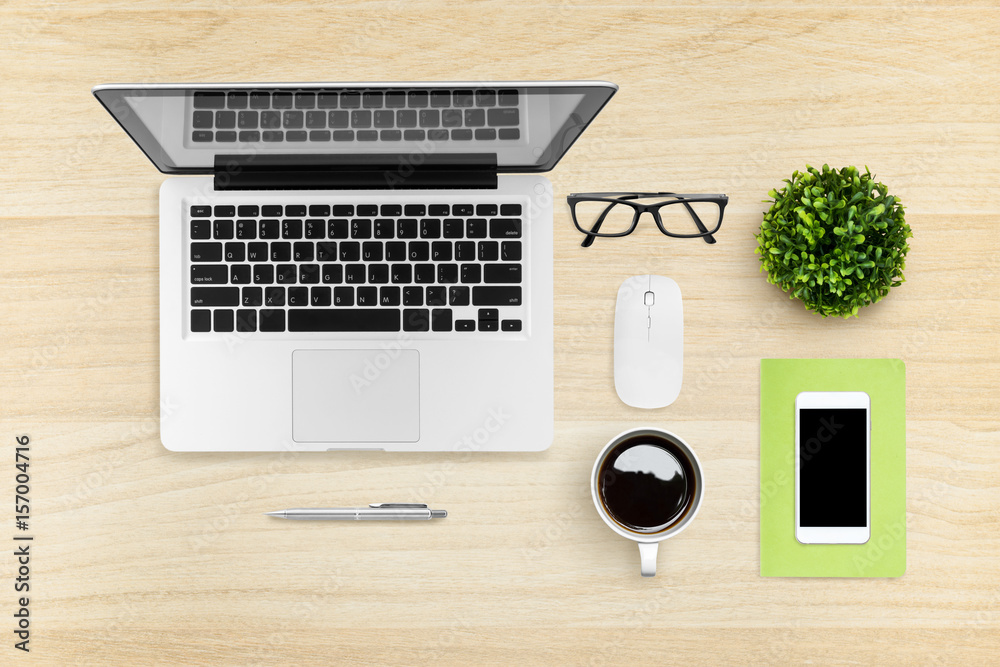 Flat lay image of hipster office desk table with laptop, smartphone, gadgets and supplies. Top view. Flat lay image of hipster office desk table with laptop, smartphone, gadgets and supplies. Top view.