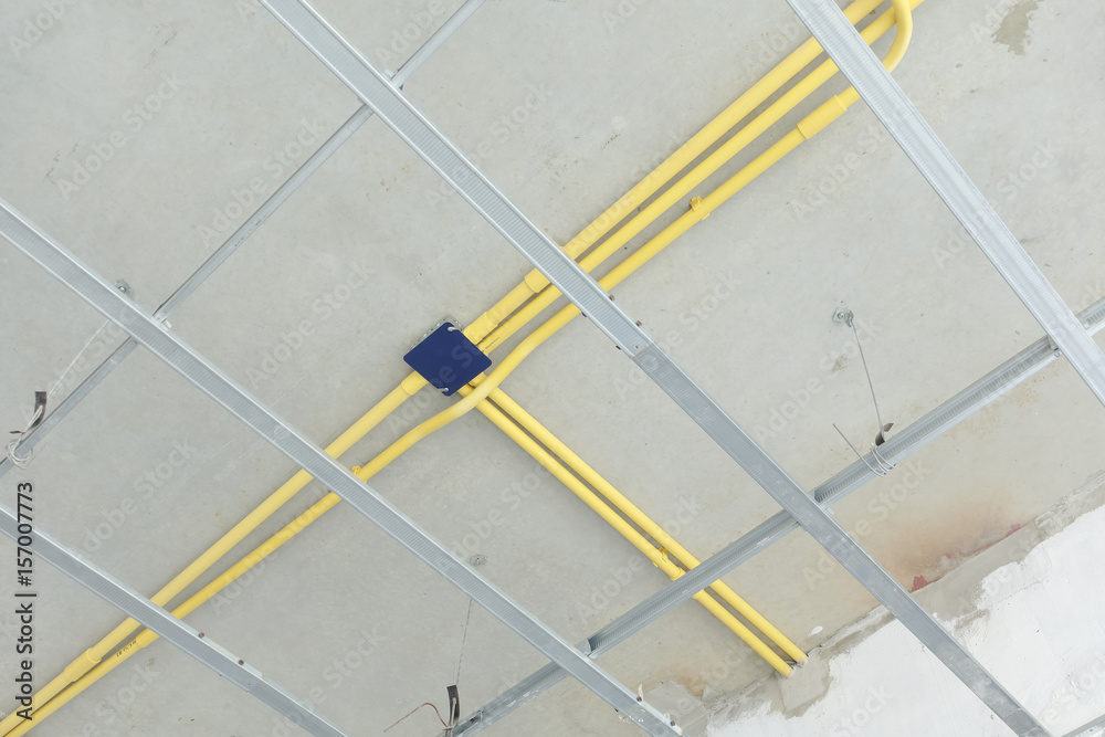 Wiring work for electrical system under concrete floor at construction