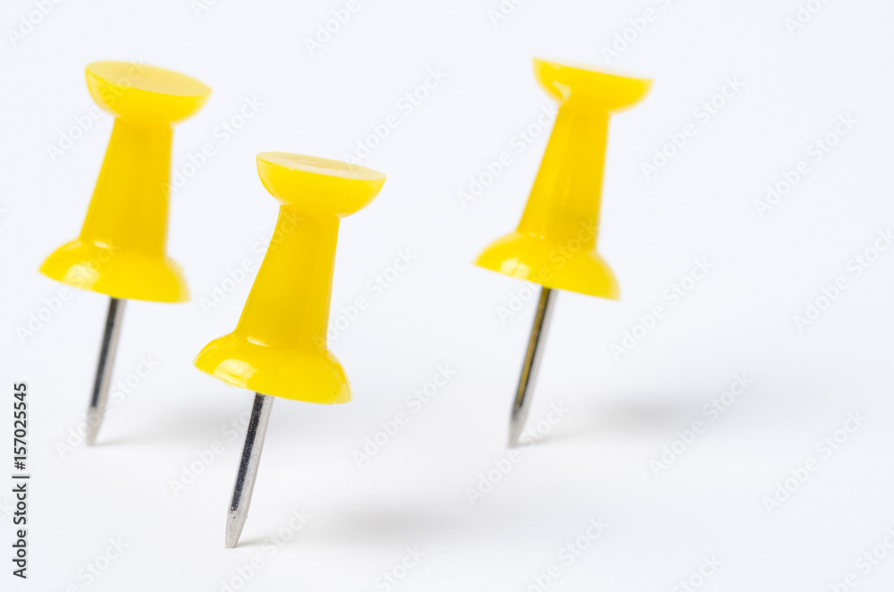 Yellow Pushpins on White Paper. Shallow Depth of Field