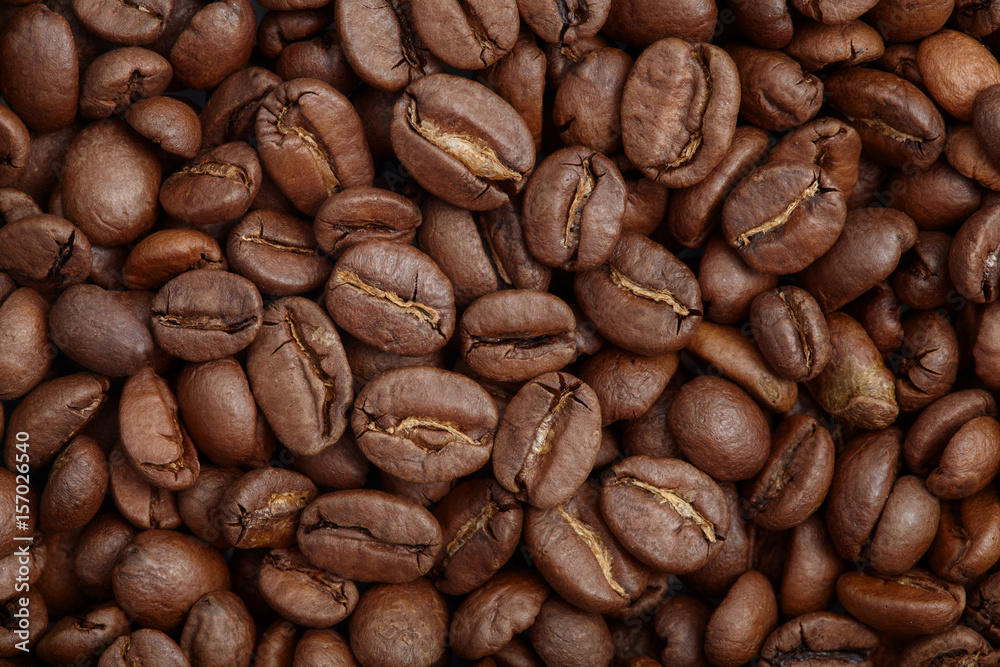 Group of brown coffee grains background, macro, close-up Group of brown coffee grains background, macro, close-up
