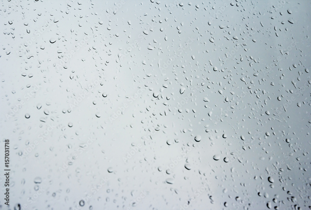 Rain drops on glass window in rainy day Rain drops on glass window in rainy day