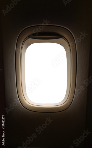 Airplane window with white copy space.