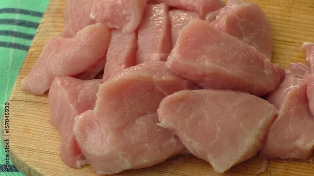 Raw pork on cutting board. Preparing meats for grilling
Raw pork on cutting board. Preparing meats for grilling
