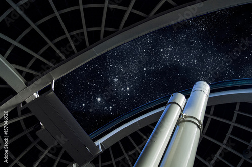 Telescope at Griffith Observatory under starry sky photo