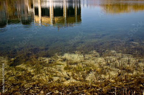 Building reflection on water. The bottom of the lake, the swamp.