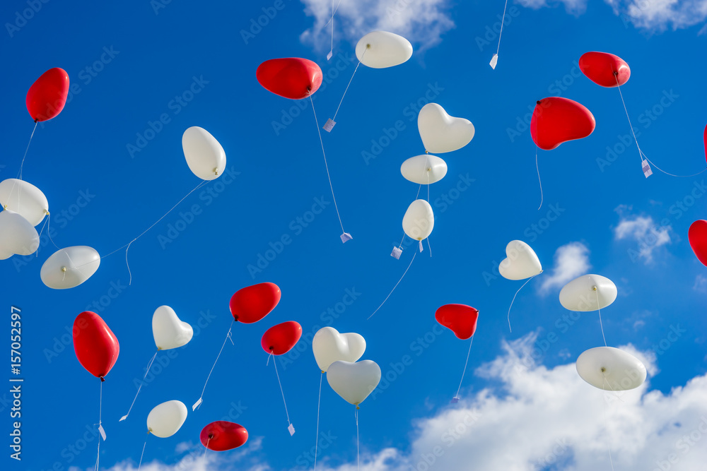 Heart balloons flying into the sky at a wedding Heart balloons flying into the sky at a wedding
