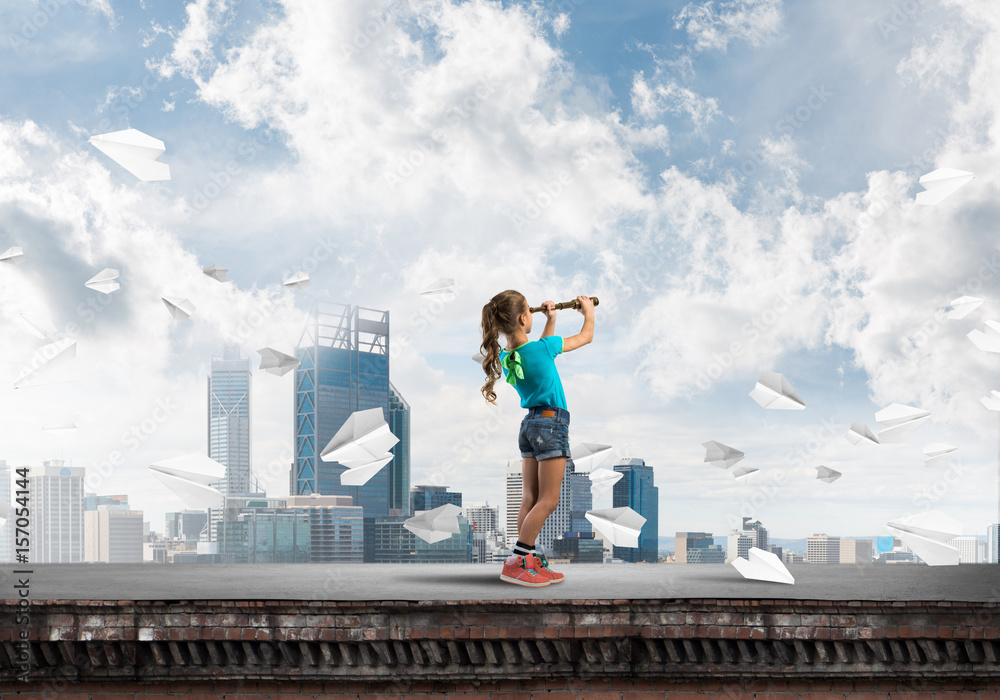 Concept of careless happy childhood with girl exploring this world Concept of careless happy childhood with girl exploring this world