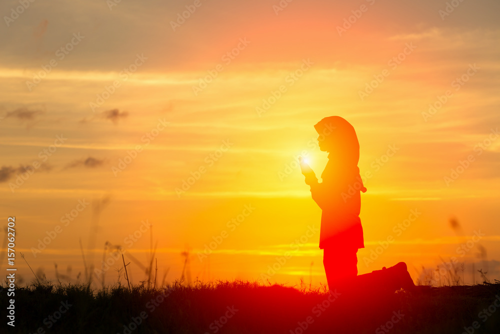 Silhouettes Muslim prayer,the light of faith, hope, faith, supplication,Muslim boy praying faith in Allah God of Islam supremely Silhouettes Muslim prayer,the light of faith, hope, faith, supplication,Muslim boy praying faith in Allah God of Islam supremely
