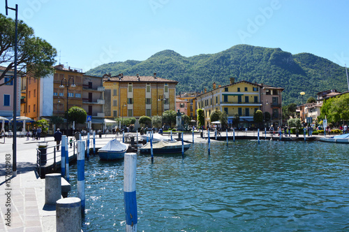 ISEO, ITALY - MAY 13, 2017: View of the pier of Iseo Lake with boats, Iseo, Italy photo