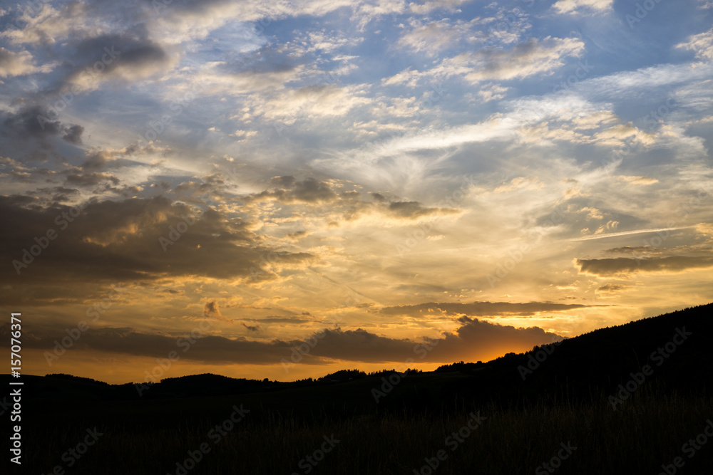 Sunset on meadow with hills and tree. Slovakia