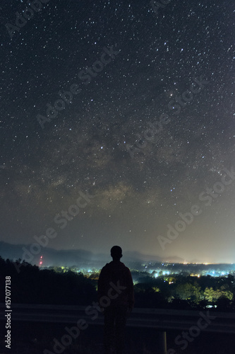 A man looking at the milky way
