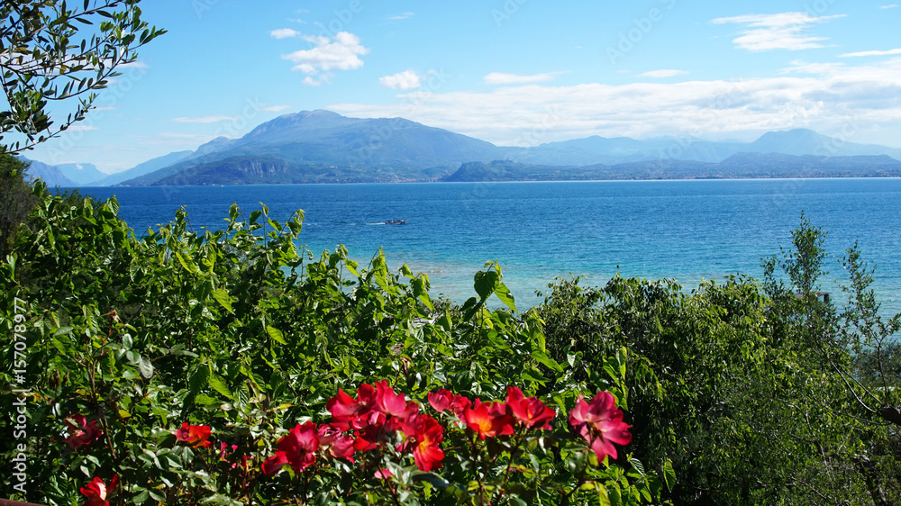 Amazing view of Lake Garda from the hills of the park Parco Pubblico Tomelleri in Sirmione town, Italy 