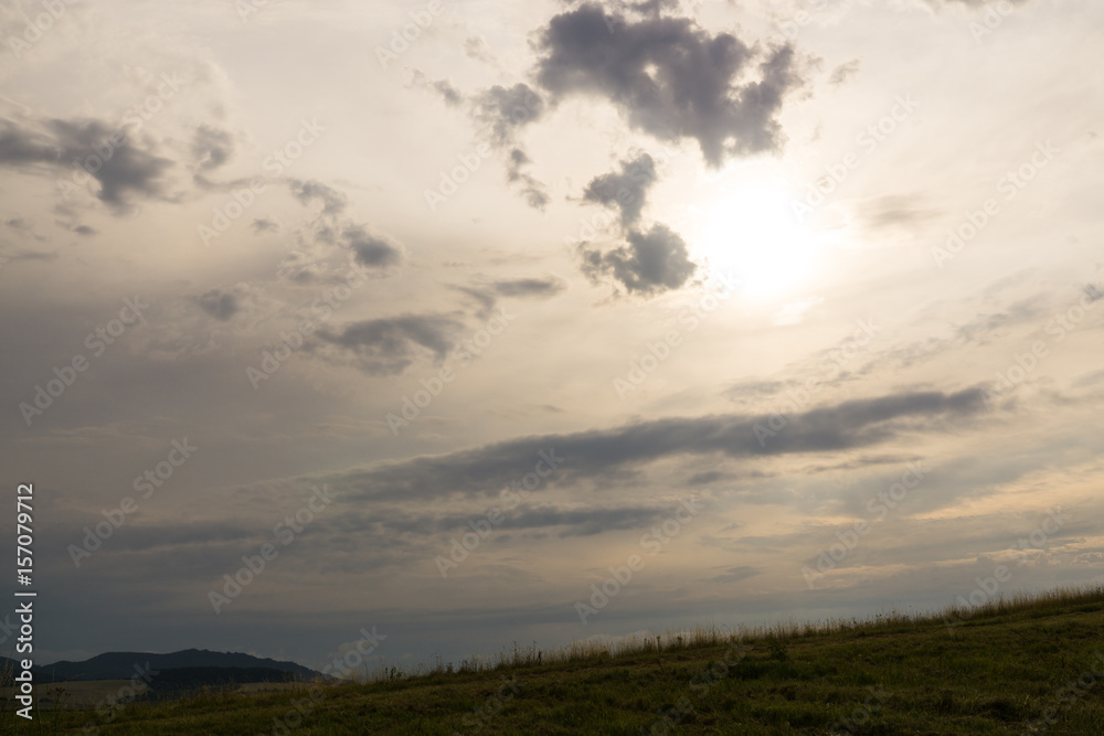 Sunset on meadow with hills and tree. Slovakia