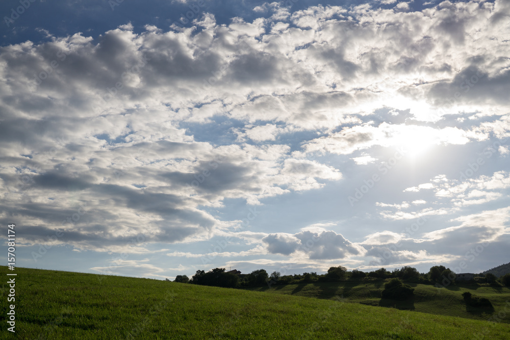 Green meadow during sunny and cloudy afternoon. Slovakia Green meadow during sunny and cloudy afternoon. Slovakia