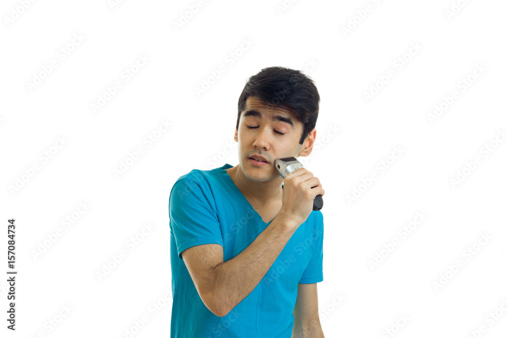 young closed his eyes and funny guy shaves his beard trimmer is young closed his eyes and funny guy shaves his beard trimmer is