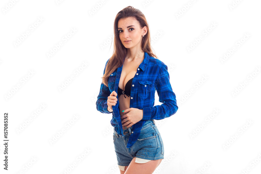 wonderful sexy girl posing on cam in shorts and unbuttoned shirt Stock  Photo | Adobe Stock